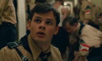 Movie still from “Europa Europa” (1990), directed by Agnieszka Holland – A young man in a uniform looking up at the sky; Close Up shot, Low angle
