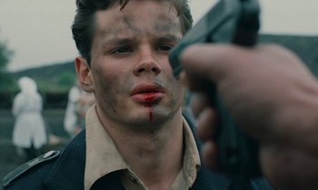 Movie still from “Europa Europa” (1990), directed by Agnieszka Holland – A man with blood all over his face; Close Up shot, Over the shoulder angle