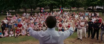 Movie still from “Evan Almighty” (2007), directed by Tom Shadyac – A crowd of people sitting and standing in the grass; Extreme Wide shot, High angle