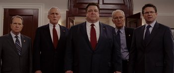 Movie still from “Evan Almighty” (2007), directed by Tom Shadyac – A group of men standing next to each other in suits; Medium shot, Low angle