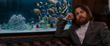 Movie still from “Evan Almighty” (2007), directed by Tom Shadyac – A man sitting in front of a fish tank; Medium shot, Over the shoulder angle