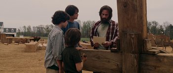 Movie still from “Evan Almighty” (2007), directed by Tom Shadyac – A group of young men standing next to each other; Medium shot, Over the shoulder angle