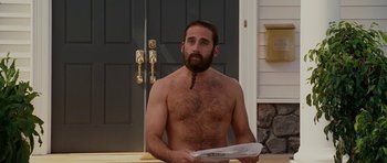 Movie still from “Evan Almighty” (2007), directed by Tom Shadyac – A man with a long beard holding a newspaper in front of a door; Medium shot, Over the shoulder angle