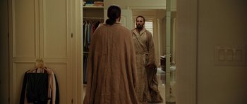 Movie still from “Evan Almighty” (2007), directed by Tom Shadyac – A man in a robe looking at himself in a mirror; Medium shot, Over the shoulder angle