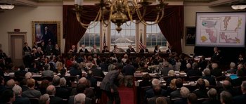 Movie still from “Evan Almighty” (2007), directed by Tom Shadyac – A room filled with people sitting at a table; Extreme Wide shot, High angle