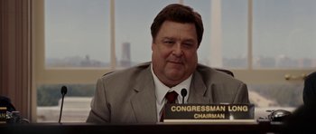 Movie still from “Evan Almighty” (2007), directed by Tom Shadyac – A person wearing a suit and tie; Medium shot, Low angle