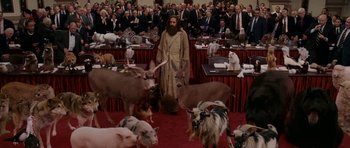 Movie still from “Evan Almighty” (2007), directed by Tom Shadyac – A man that is standing in front of some animals; Wide shot, High angle