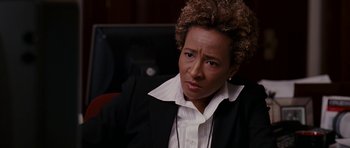 Movie still from “Evan Almighty” (2007), directed by Tom Shadyac – A woman in a black jacket and a white shirt; Close Up shot, High angle