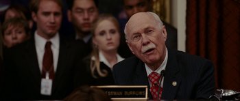 Movie still from “Evan Almighty” (2007), directed by Tom Shadyac – An older man in a suit and a red polka dot neck tie; Close Up shot, Low angle