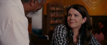 Movie still from “Evan Almighty” (2007), directed by Tom Shadyac – A woman sitting at a table in front of a man; Close Up shot, Over the shoulder angle