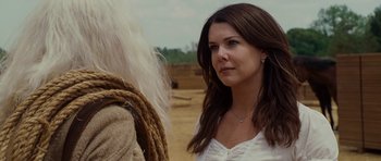 Movie still from “Evan Almighty” (2007), directed by Tom Shadyac – A woman standing next to a man in a field; Close Up shot, Over the shoulder angle