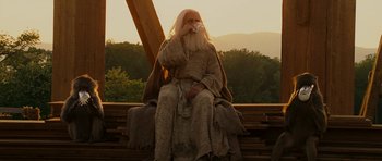 Movie still from “Evan Almighty” (2007), directed by Tom Shadyac – An old man sitting on top of a wooden structure; Medium shot, Low angle