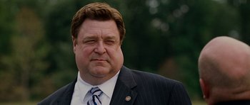 Movie still from “Evan Almighty” (2007), directed by Tom Shadyac – A person wearing a suit and tie; Close Up shot, Low angle