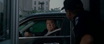 Movie still from “Evan Almighty” (2007), directed by Tom Shadyac – A man sitting in the driver's seat of a car; Medium shot, Over the shoulder angle