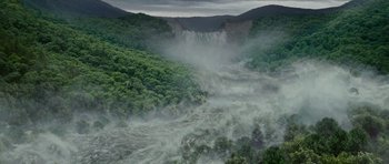 Movie still from “Evan Almighty” (2007), directed by Tom Shadyac – A view of a waterfall in the middle of a forest; Extreme Wide shot, High angle