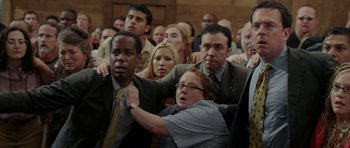 Movie still from “Evan Almighty” (2007), directed by Tom Shadyac – A group of people standing around each other in front of a crowd; Medium shot, High angle
