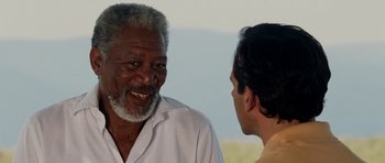 Movie still from “Evan Almighty” (2007), directed by Tom Shadyac – Two men talking to each other in front of a sky background; Close Up shot, Over the shoulder angle