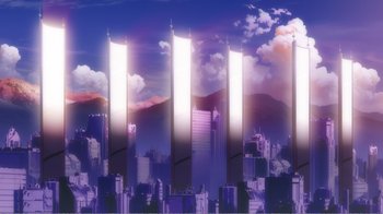 Movie still from “Evangelion: 2.0 You Can (Not) Advance” (2009), directed by Joe Fria – A series of skyscrapers in a city with a mountain in the background; Extreme Wide shot, Low angle