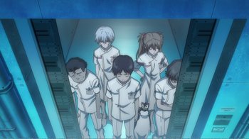 Movie still from “Evangelion: 2.0 You Can (Not) Advance” (2009), directed by Joe Fria – A group of people standing next to each other in a room; Wide shot, Low angle