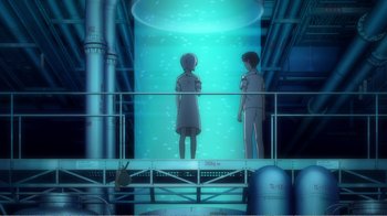 Movie still from “Evangelion: 2.0 You Can (Not) Advance” (2009), directed by Joe Fria – A couple of people standing on a platform in front of an aquarium; Wide shot, High angle