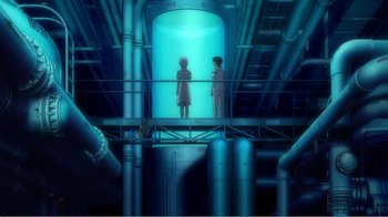 Movie still from “Evangelion: 2.0 You Can (Not) Advance” (2009), directed by Joe Fria – Two people are standing in an industrial setting; Extreme Wide shot, High angle