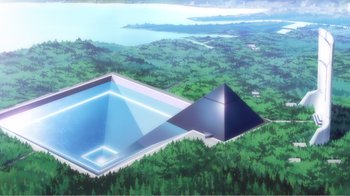 Movie still from “Evangelion: 2.0 You Can (Not) Advance” (2009), directed by Joe Fria – An aerial view of a swimming pool and a pyramid shaped building; Extreme Wide shot, High angle
