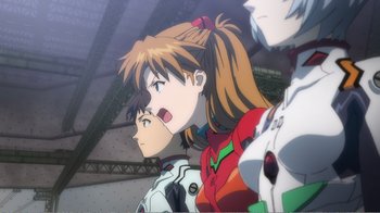 Movie still from “Evangelion: 2.0 You Can (Not) Advance” (2009), directed by Joe Fria – A group of people standing next to each other in a room; Close Up shot, Low angle