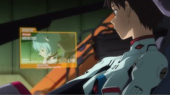 Movie still from “Evangelion: 2.0 You Can (Not) Advance” (2009), directed by Joe Fria – A man sitting in front of a television screen; Close Up shot, Over the shoulder angle