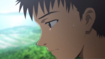 Movie still from “Evangelion: 2.0 You Can (Not) Advance” (2009), directed by Joe Fria – An anime character with a sad look on his face; Extreme Close Up shot, Low angle