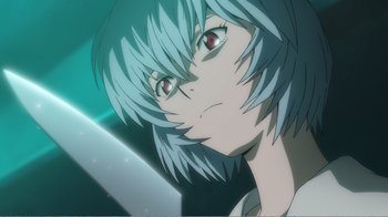 Movie still from “Evangelion: 2.0 You Can (Not) Advance” (2009), directed by Joe Fria – A person with a knife in their mouth; Extreme Close Up shot, Low angle