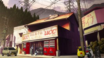 Movie still from “Evangelion: 2.0 You Can (Not) Advance” (2009), directed by Joe Fria – An image of an asian store with a yellow car parked in front of it; Extreme Wide shot, Low angle