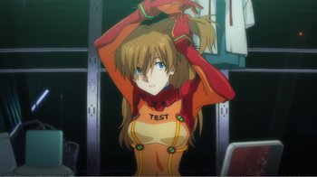 Movie still from “Evangelion: 2.0 You Can (Not) Advance” (2009), directed by Joe Fria – A woman in a yellow and red outfit standing in a room; Close Up shot, Over the shoulder angle