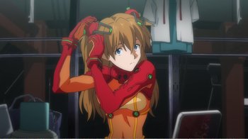Movie still from “Evangelion: 2.0 You Can (Not) Advance” (2009), directed by Joe Fria – A woman in a red and yellow outfit holding her hair; Close Up shot, Low angle