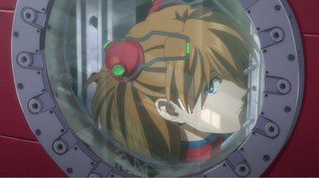 Movie still from “Evangelion: 2.0 You Can (Not) Advance” (2009), directed by Joe Fria – A girl with headphones is seen through a bubble; Close Up shot, High angle