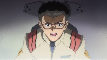 Movie still from “Evangelion: 2.0 You Can (Not) Advance” (2009), directed by Joe Fria – An animated man wearing glasses and a white jacket; Close Up shot, Overhead angle