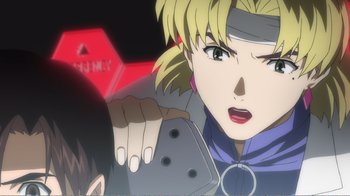 Movie still from “Evangelion: 2.0 You Can (Not) Advance” (2009), directed by Joe Fria – A blonde haired woman is holding something up to her face; Close Up shot, Over the shoulder angle