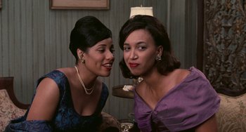 Movie still from “Eve's Bayou” (1997), directed by Kasi Lemmons – A couple of women sitting next to each other at a table; Close Up shot, High angle