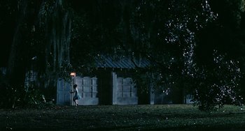 Movie still from “Eve's Bayou” (1997), directed by Kasi Lemmons – A little girl standing next to a street light in the dark; Extreme Wide shot, Low angle
