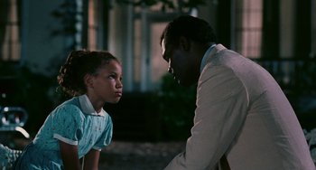 Movie still from “Eve's Bayou” (1997), directed by Kasi Lemmons – A man and a little girl talking to each other; Close Up shot, Over the shoulder angle