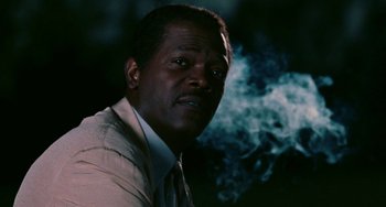 Movie still from “Eve's Bayou” (1997), directed by Kasi Lemmons – A person wearing a suit and tie; Close Up shot, Low angle