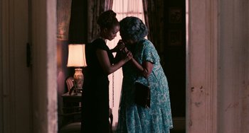 Movie still from “Eve's Bayou” (1997), directed by Kasi Lemmons – Two women in a room with a lamp; Medium shot, Over the shoulder angle