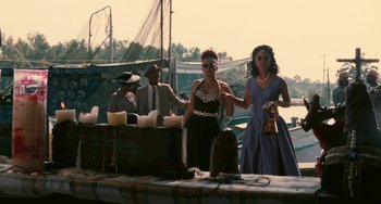 Movie still from “Eve's Bayou” (1997), directed by Kasi Lemmons – A group of people standing next to each other on a dock; Wide shot, Low angle
