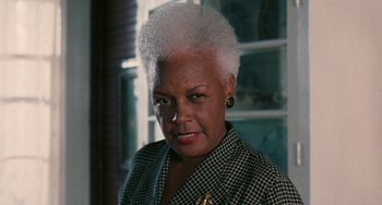 Movie still from “Eve's Bayou” (1997), directed by Kasi Lemmons – An older woman with white hair is looking at the camera; Close Up shot, High angle