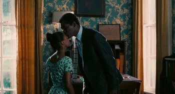 Movie still from “Eve's Bayou” (1997), directed by Kasi Lemmons – A man and a woman kissing in a room; Medium shot, Over the shoulder angle