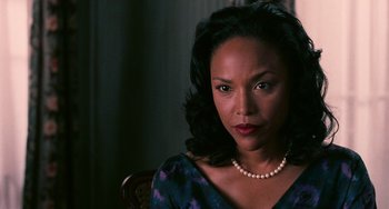Movie still from “Eve's Bayou” (1997), directed by Kasi Lemmons – A person wearing a necklace; Close Up shot, Over the shoulder angle