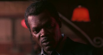 Movie still from “Eve's Bayou” (1997), directed by Kasi Lemmons – A person wearing a suit and tie; Close Up shot, Low angle