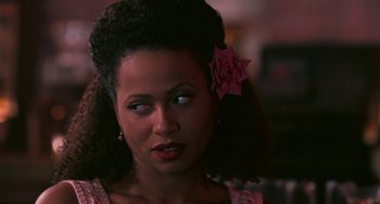 Movie still from “Eve's Bayou” (1997), directed by Kasi Lemmons – A person with a flower in her hair; Close Up shot, Over the shoulder angle