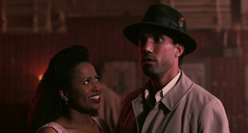 Movie still from “Eve's Bayou” (1997), directed by Kasi Lemmons – A man and a woman standing next to each other; Close Up shot, Over the shoulder angle