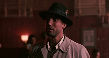 Movie still from “Eve's Bayou” (1997), directed by Kasi Lemmons – A man wearing a hat and a jacket; Close Up shot, Low angle