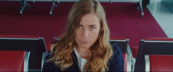 Movie still from “Everybody Loves Jeanne” (2022), directed by Céline Devaux – A person with long blonde hair; Close Up shot, High angle